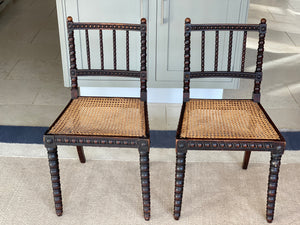 2 ebonised bobbin chairs with cane seats