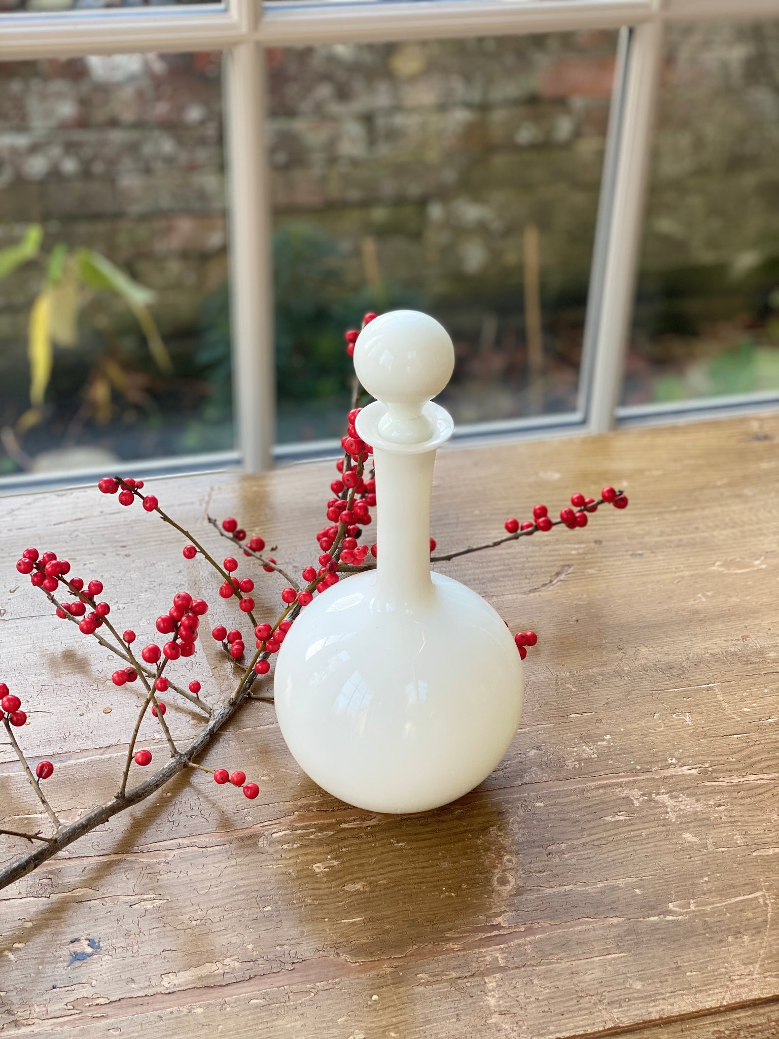 Vintage white opaque decanter with stopper