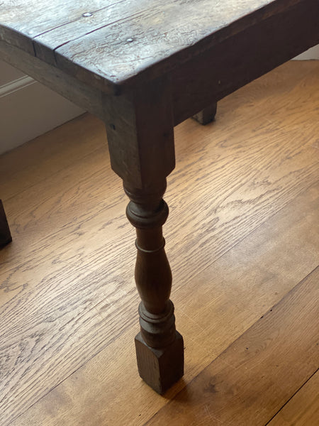 A very rustic oak side table