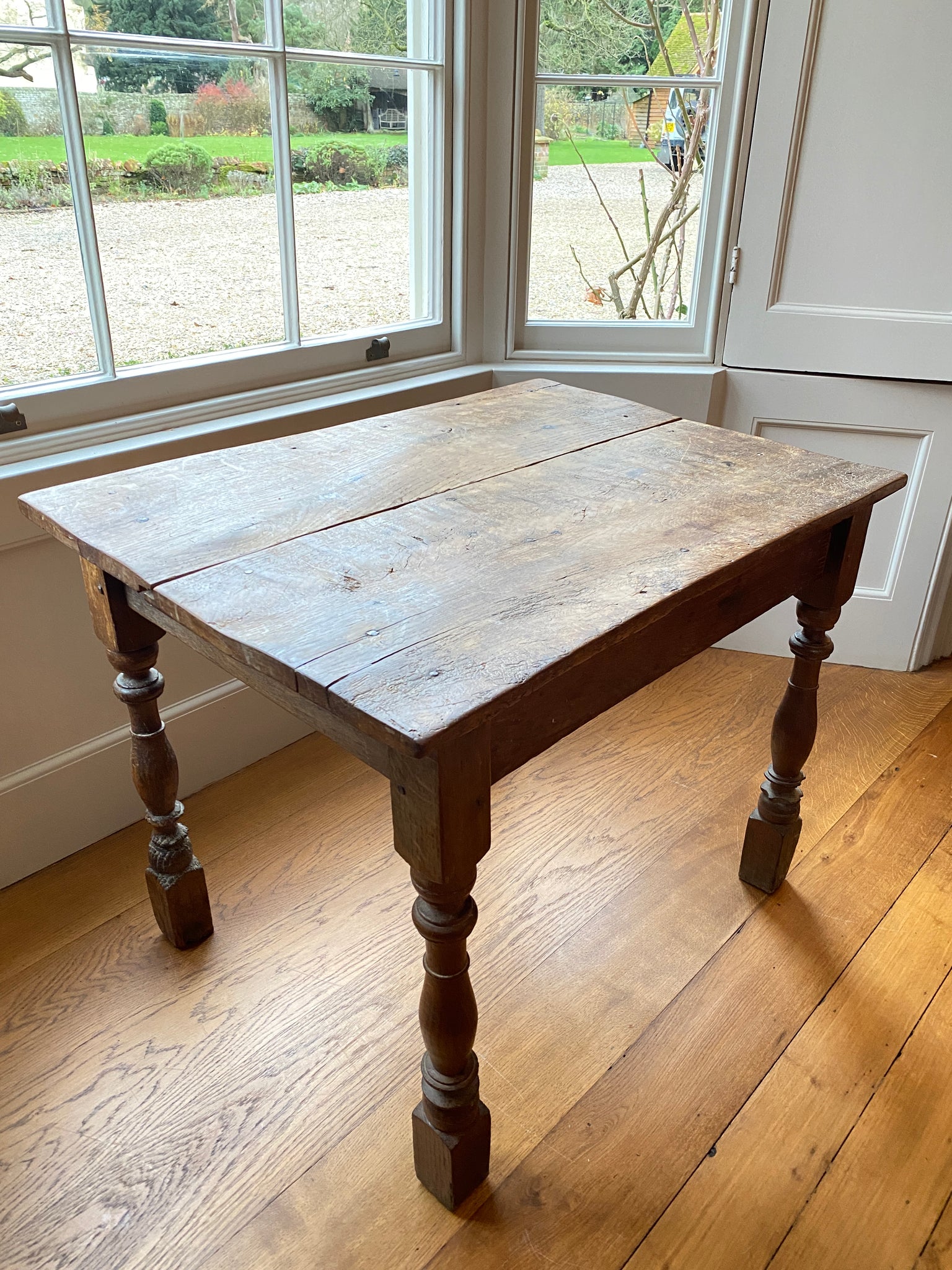 A very rustic oak side table