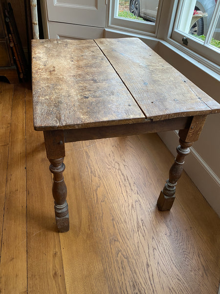 A very rustic oak side table