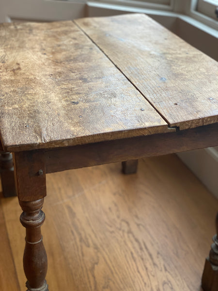 A very rustic oak side table