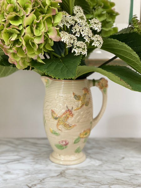 Pretty cream jug with floral motifs