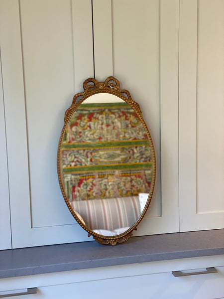 Charming Metal & Gilt Mirror with Bow at top