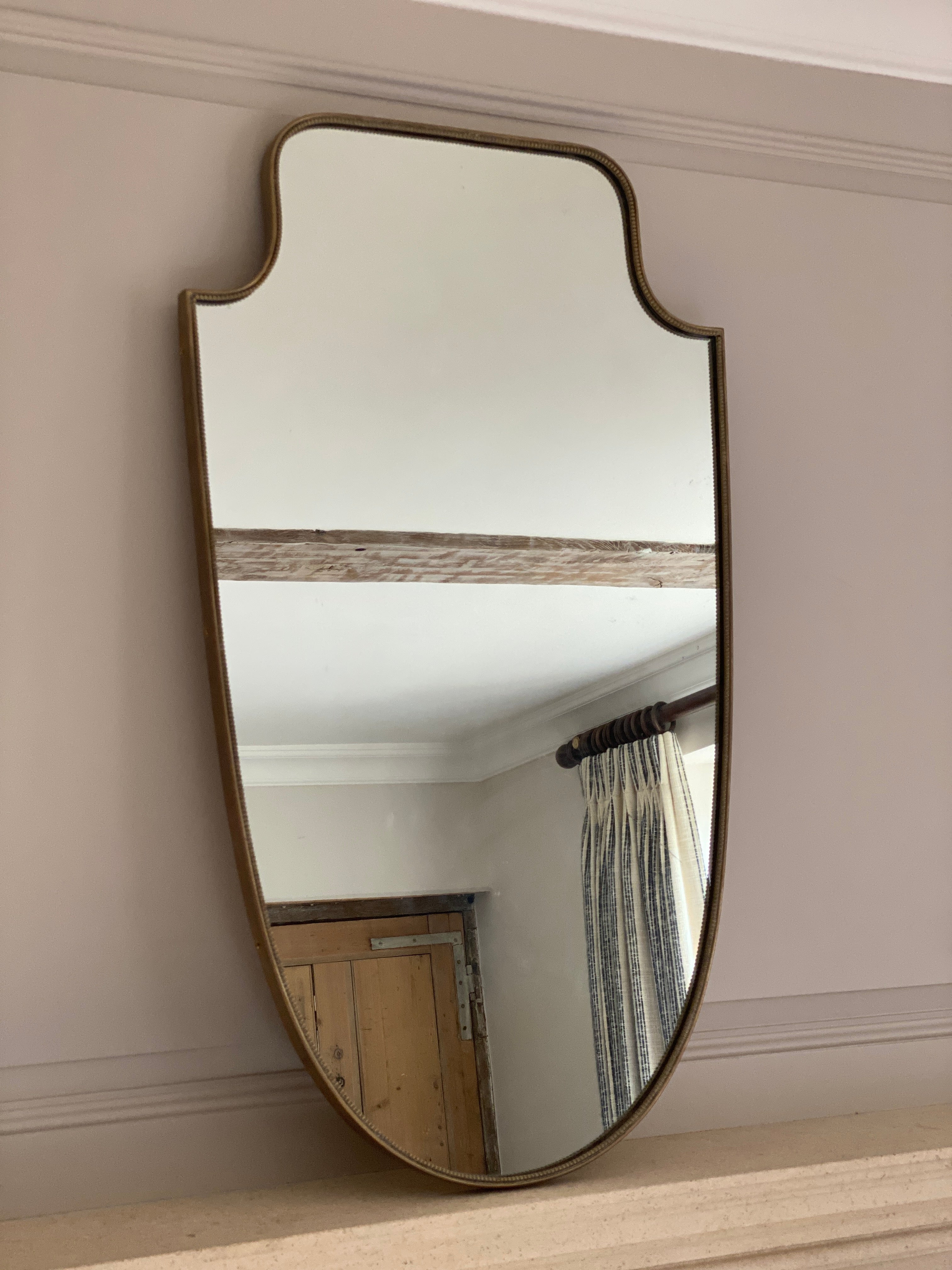 Beautiful Italian Mid Century Shield Mirror in brass