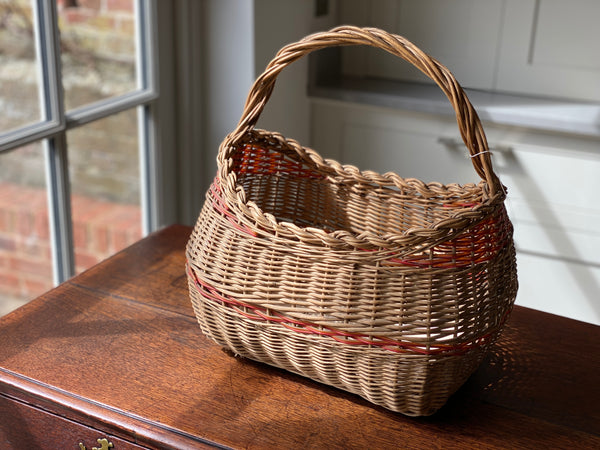 Vintage French wicker basket with red striping