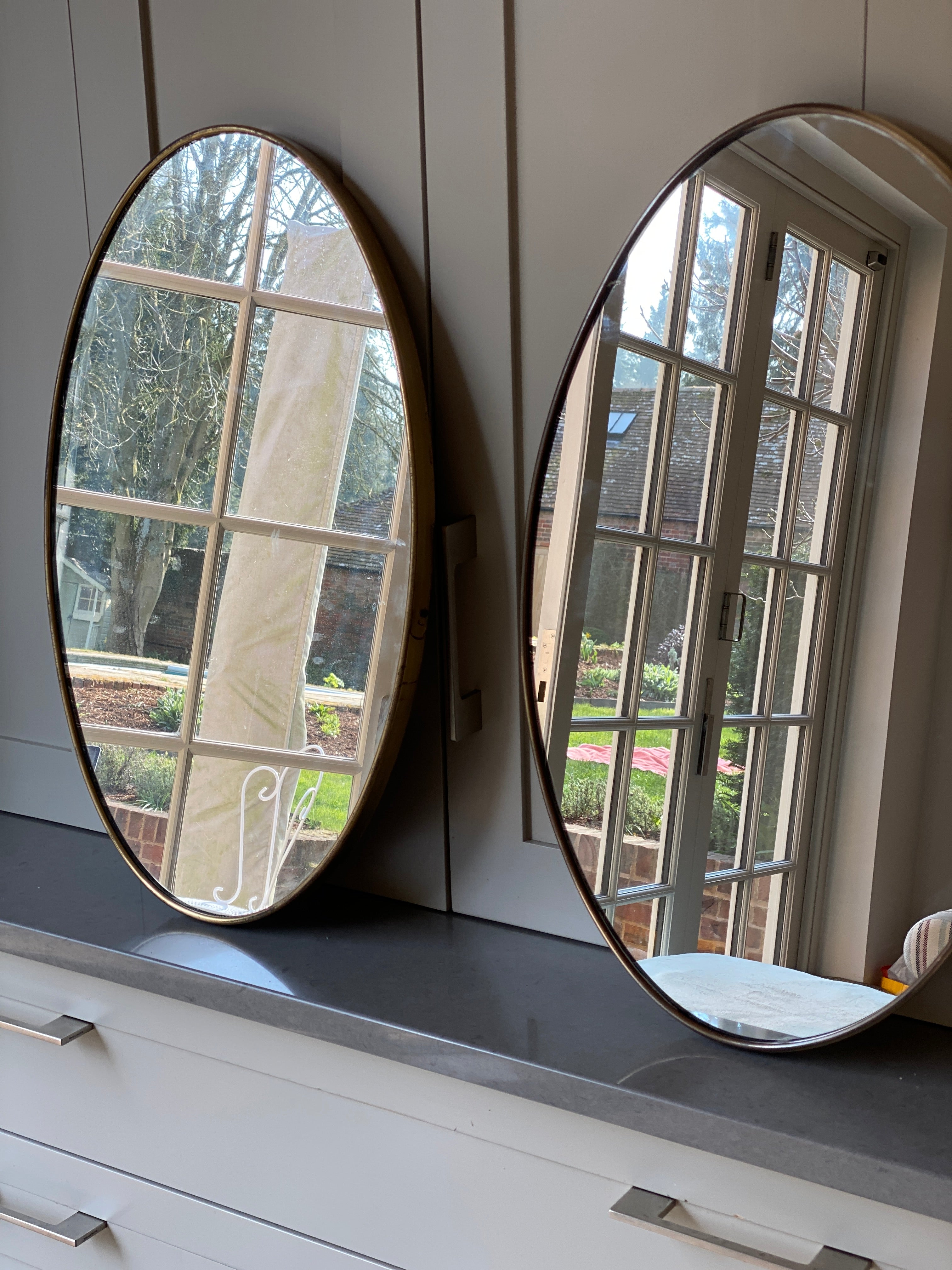 Lovely Mid-Century Pair of Oval Brass Mirrors